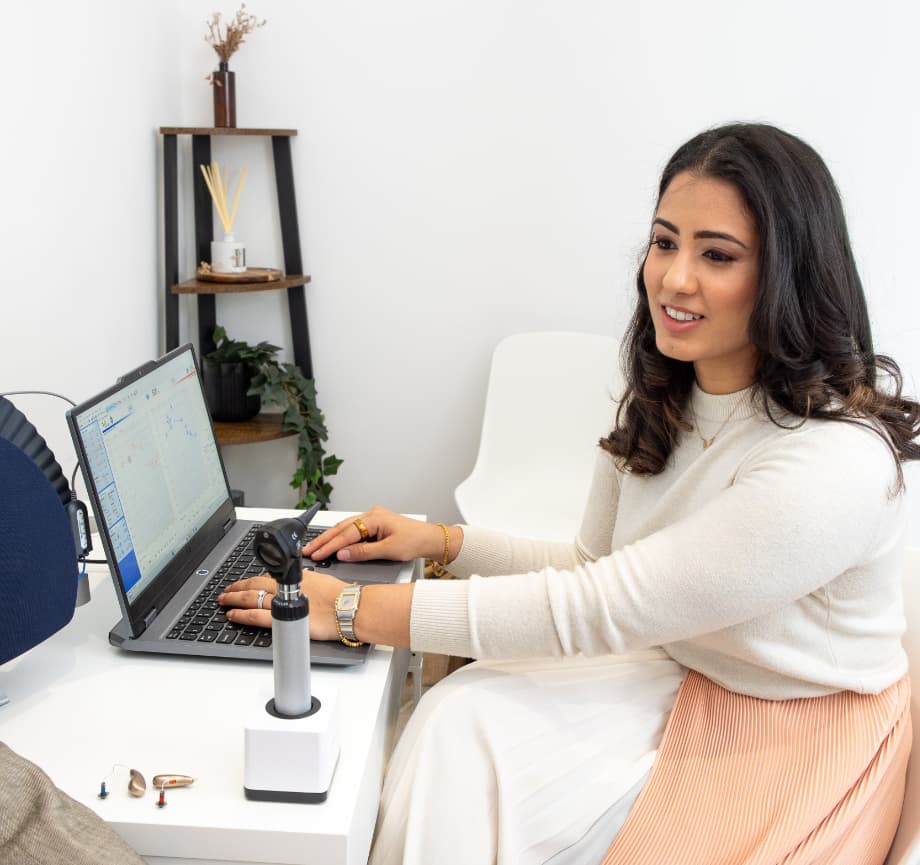 Dr Yovina speaking with a client