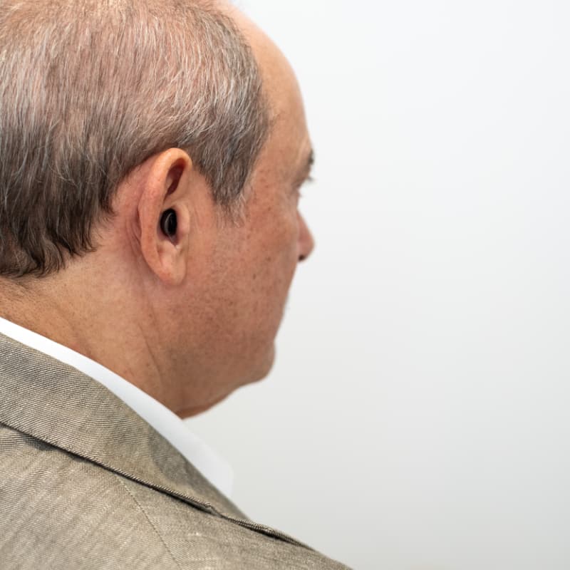 Man wearing Invisible-in-Canal IIC hearing aids
